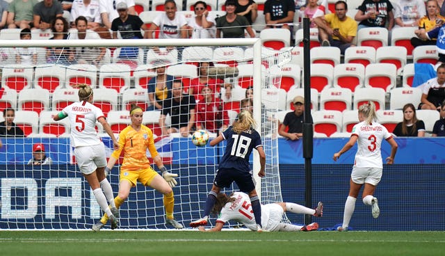 Claire Emslie, centre, scores Scotland's goal against England