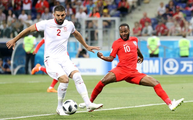 Raheem Sterling with the spots on the socks showing below some strapping 