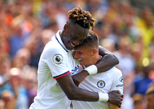 Tammy Abraham hugs Mason Mount as the pair's goals secure Chelsea a 3-2 win at Norwich