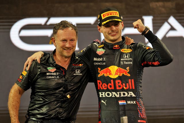 Max Verstappen celebrates last season's title win alongside Red Bull team principle Christian Horner