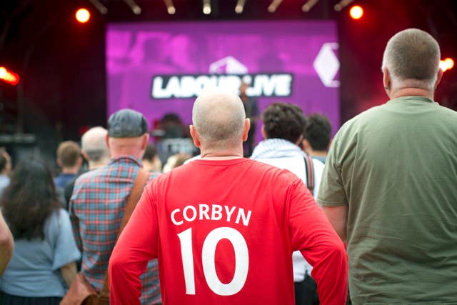 A man wearing a Jeremy Corbyn shirt with number 10 on the back