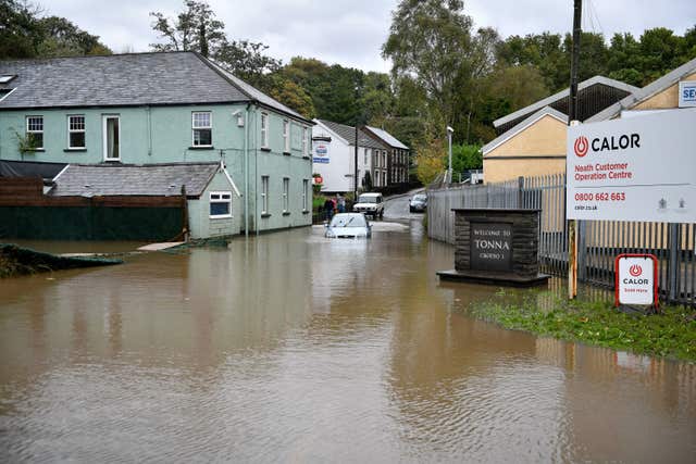 A car is stranded in floodwater in Tonna near Aberdulais, Neath, South Wales 