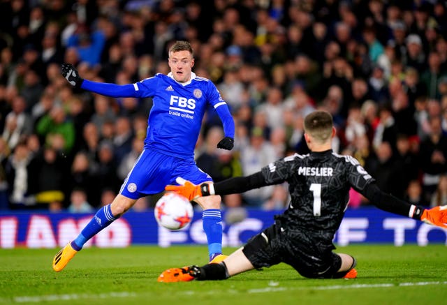 Jamie Vardy, left, scores past Illan Meslier to earn Leicester a draw