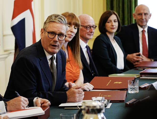 Sir Keir Starmer sits at a table with four other people for a cabinet meeting 