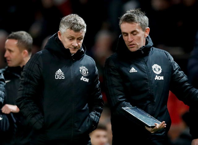 Kieran McKenna, right, says Manchester United are working on the premise that they can return to some form of training next month (Martin Rickett/PA)