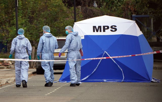 Forensic officers at the scene near to Cayton Road, Greenford, in west London,