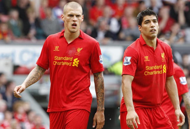 Luis Suarez and Martin Skrtel stand dejected during Liverpool’s defeat to Arsenal in September 2012