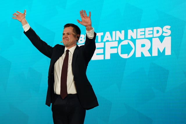 Robert Jenrick reacts after delivering a speech during a Reform UK rally on Monday