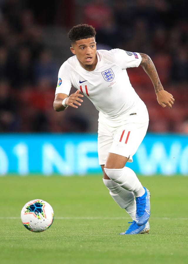 Jadon Sancho chases the ball