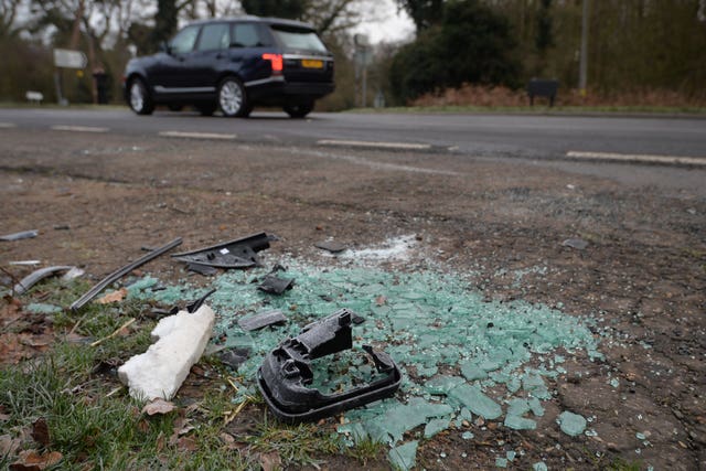 Broken glass and car parts on the side of the A149