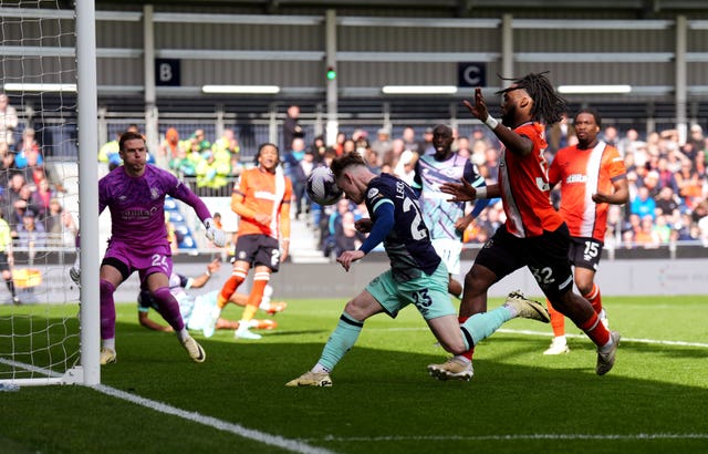 Keane Lewis-Potter, centre, scores Brentford’s fourth goal against Luton