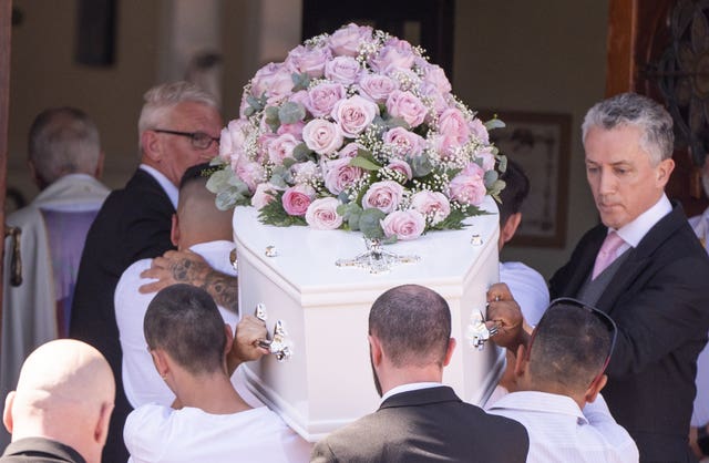 The coffin is carried into St Patrick’s Church