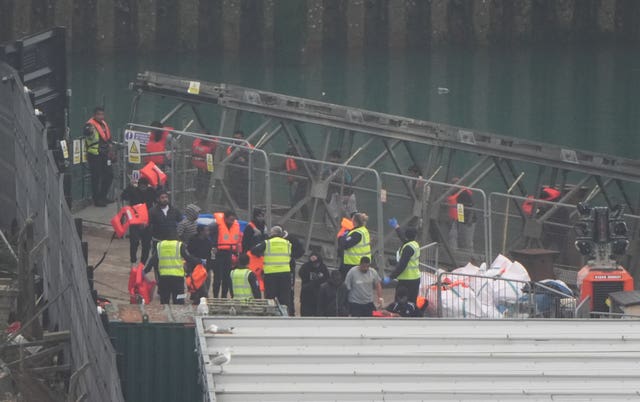 A group of people thought to be migrants are brought in to Dover, Kent, from a Border Force vessel following a small boat incident in the Channel