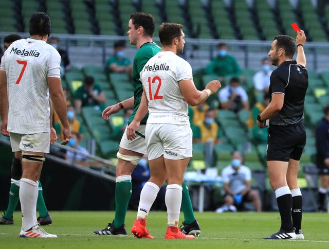 USA’s Riekert Hattingh, left, was sent off by referee Mathieu Raynal