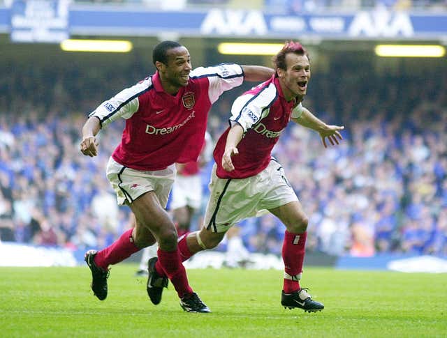 Freddie Ljungberg, right, celebrates with Thierry Henry after sealing Arsenal's 2002 success over Chelsea