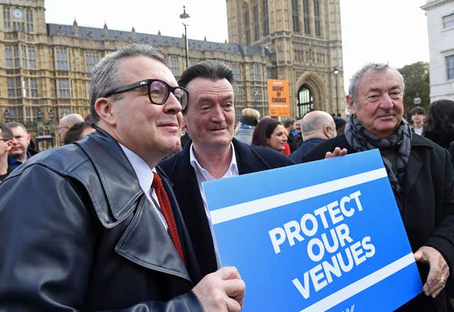 (Left to right) Labour’s deputy leader Tom Watson, Feargal Sharkey and Pink Floyd's Nick Mason join a gathering outside the Houses of Parliament in London calling for a change in the law to protect live venues across the UK (Stefan Rousseau/PA)