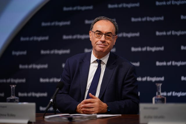 Governor of the Bank of England Andrew Bailey smiles at the camera