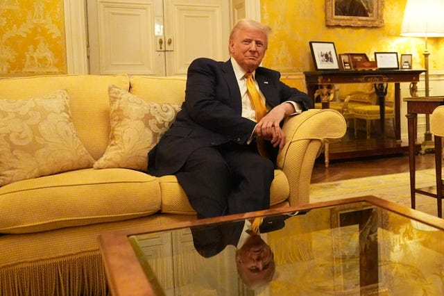 Donald Trump sitting on a yellow sofa