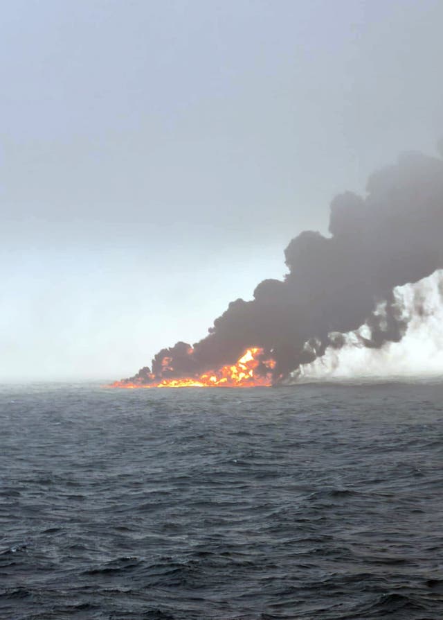 Black smoke billowing into the air after a crash between an oil tanker and a cargo ship off the coast of East Yorkshire