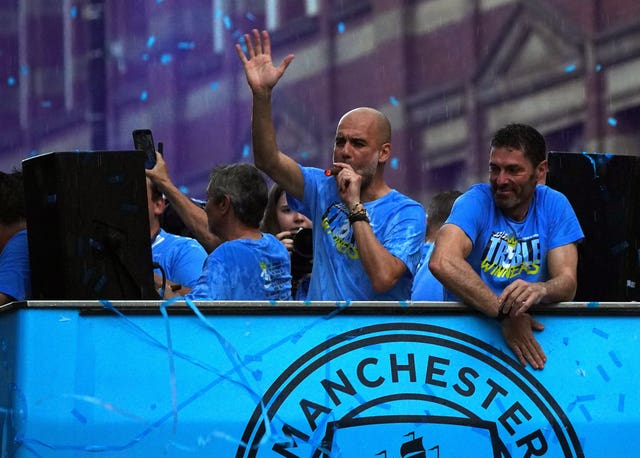 Manchester City manager Pep Guardiola (left) smokes a cigar