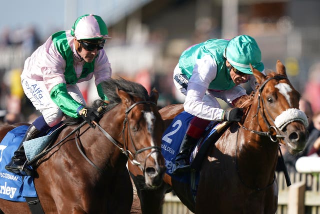 Chaldean (right) ridden by Frankie Dettori on way to winning Darley Dewhurst Stakes at Newmarket Racecourse