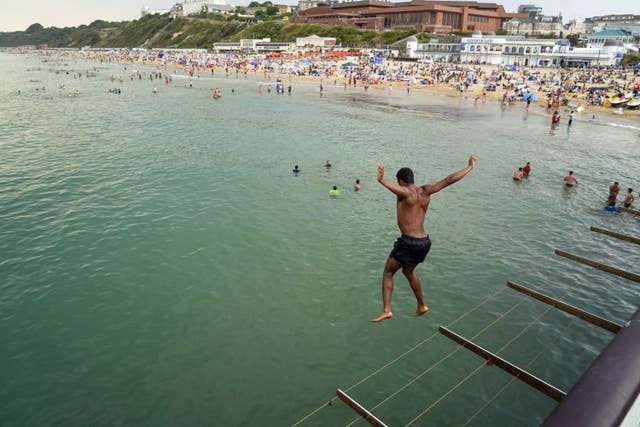 A man jumps from the pier in Bournemouth