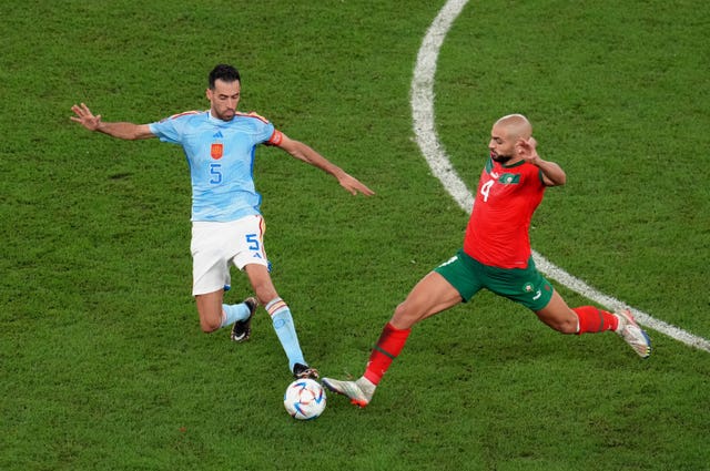 Morocco’s Sofyan Amrabat tackles Spain's Sergio Busquets