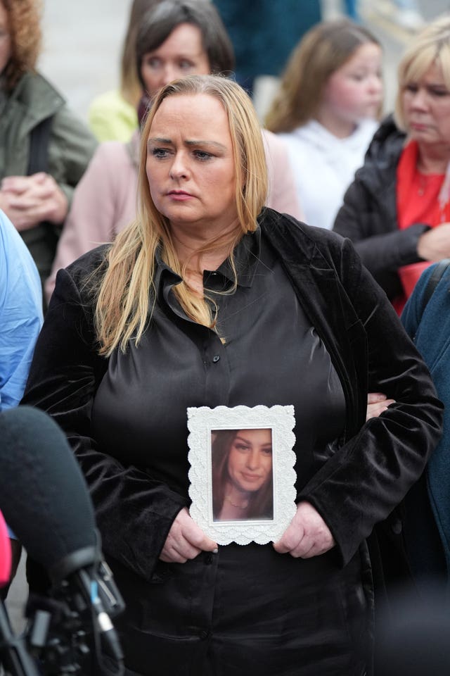 Donna Harper holding a picture of daughter Leona