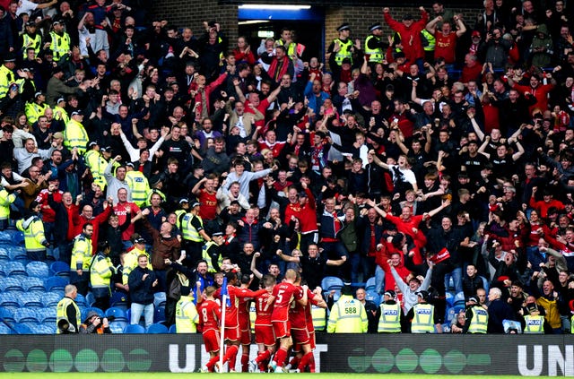 Aberdeen celebrate in front of their fans after Jack MacKenzie's goal against Rangers