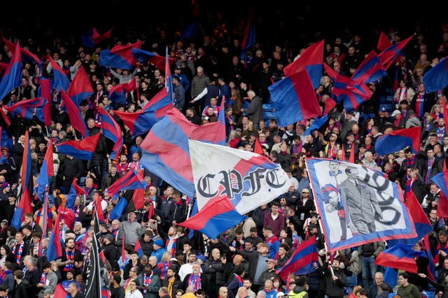 Crystal Palace fans wave flags during the Conference League match against Shakhtar Donetsk