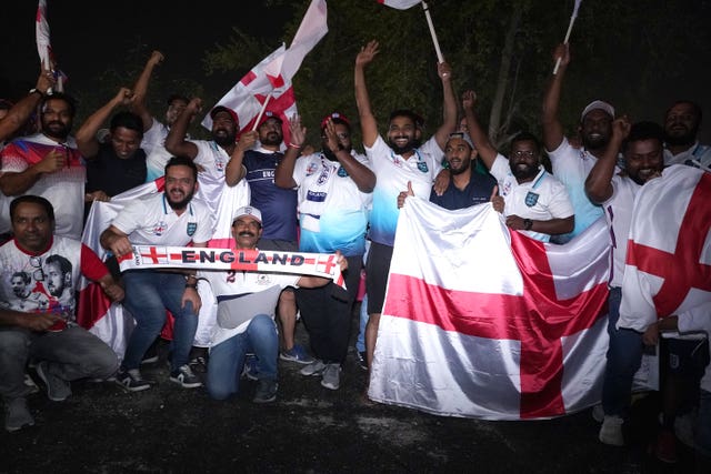 Fans greet England's arrival at their training base in Al Wakra