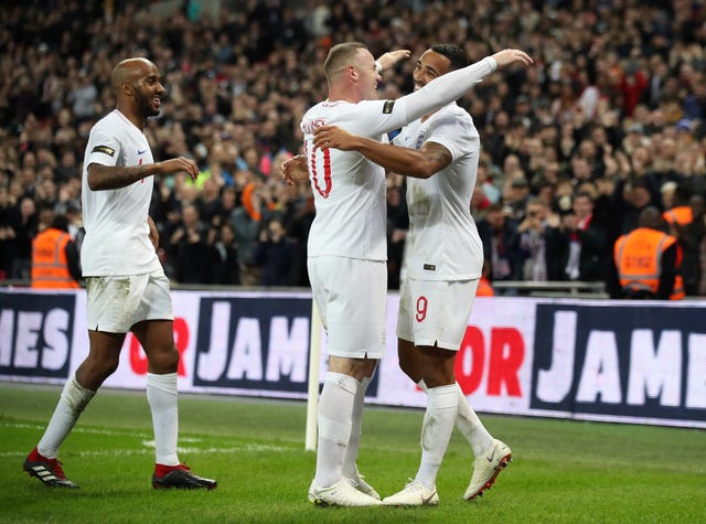 England’s Callum Wilson (right) celebrates scoring with Rooney