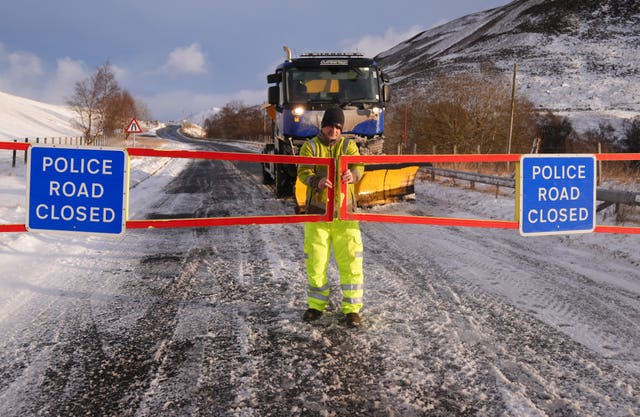 A snow plough driver at the closed snow gates on the A93 in Spittal of Glenshee