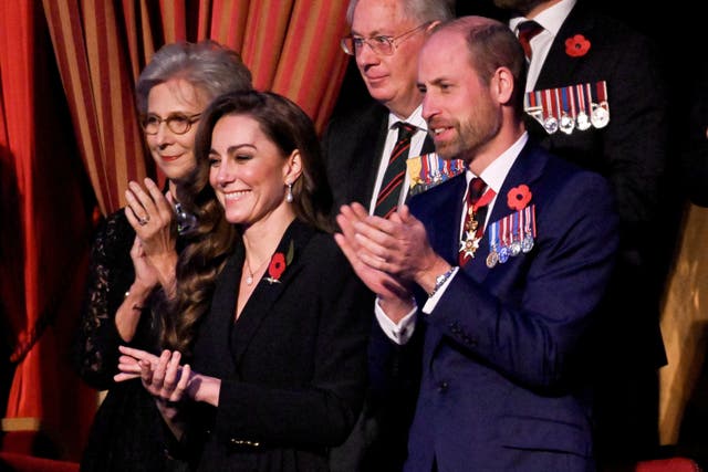 Kate and William stand and applaud at the annual Royal British Legion Festival of Remembrance at the Royal Albert Hall