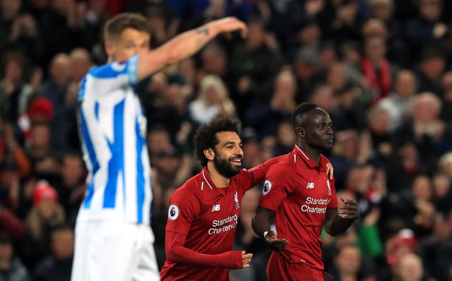 Liverpool's Mohamed Salah and Sadio Mane, right, celebrate a goal against Huddersfield