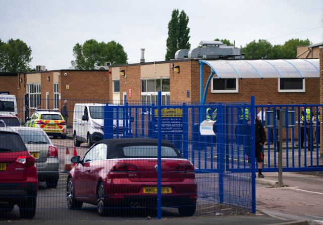 Emergency services at Tewkesbury Academy, which was locked down after a teenage boy was arrested following reports a pupil stabbed a teacher 