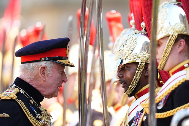 The King inspects soldiers on parade