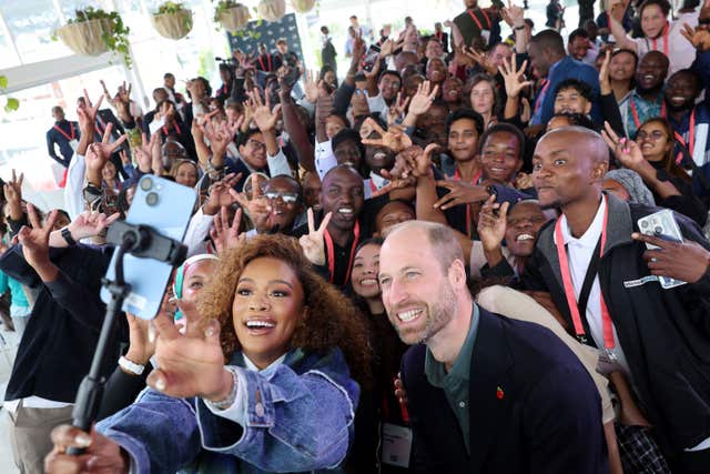 The Prince of Wales poses for a selfie