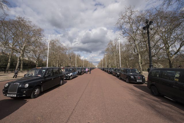 London black cabs line The Mall near Buckingham Palace