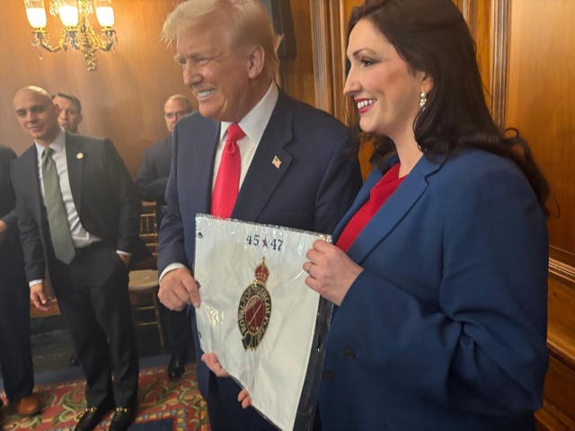 Emma Little-Pengelly presents Donald Trump with a personalised flag from Royal Portrush Golf Club