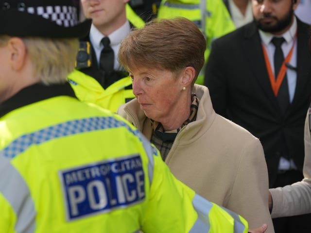 Former Post Office boss Paula Vennells surrounded by police