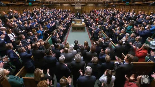 MPs give a standing ovation after Ukrainian President Volodymyr Zelensky addressed the Commons via videolink 
