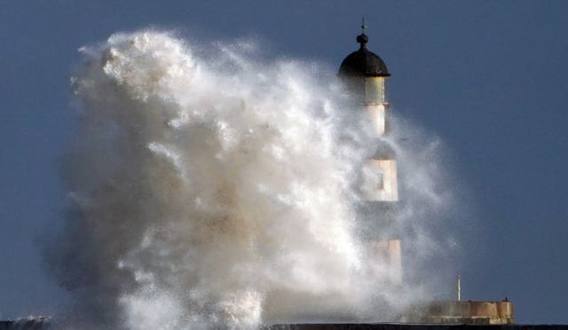 Waves hit the lighthouse at Seaham in Durham 