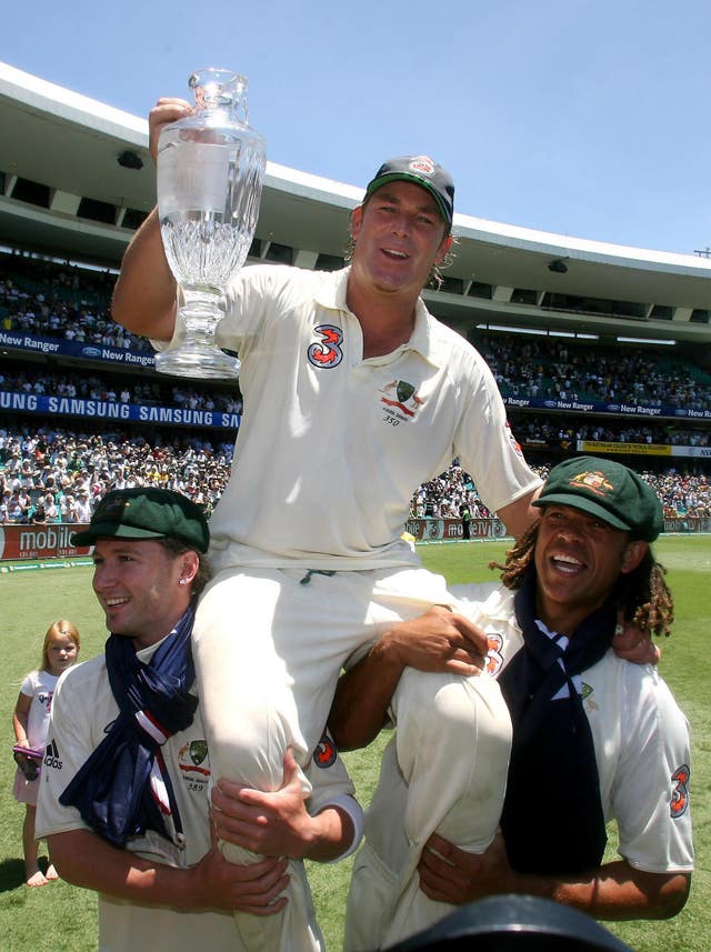 Michael Clarke and Andrew Symonds carry Shane Warne