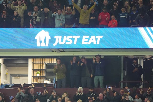 The Prince of Wales celebrates in the stands 