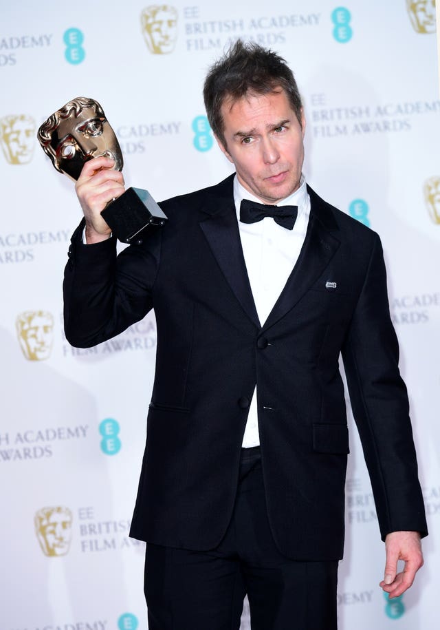 Sam Rockwell paid tribute to the late Alan Rickman as he collected the award for supporting actor (Ian West/PA)
