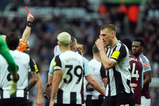 Aston Villa’s Jhon Duran (second from right) is shown a red card by referee Anthony Taylor (obscured)