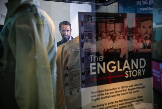 Gareth Southgate looking at exhibits at the National Football Museum in Manchester 