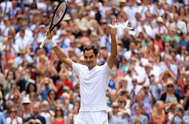 Roger Federer celebrates on centre court