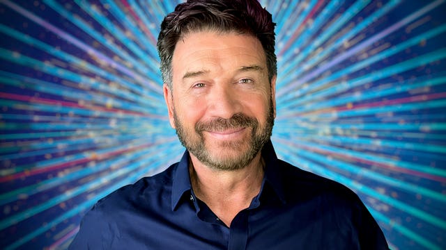 Nick Knowles in a blue outfit